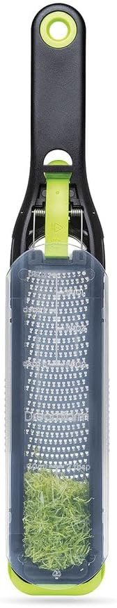 Dreamfarm Ozest Self-Cleaning Zester with Pop Button – 1mm Fine Zesting | Grates fine, citrus zest, parmesan, nutmeg and spices with concave, sharp stainless steel plane and non-slip silicone foot